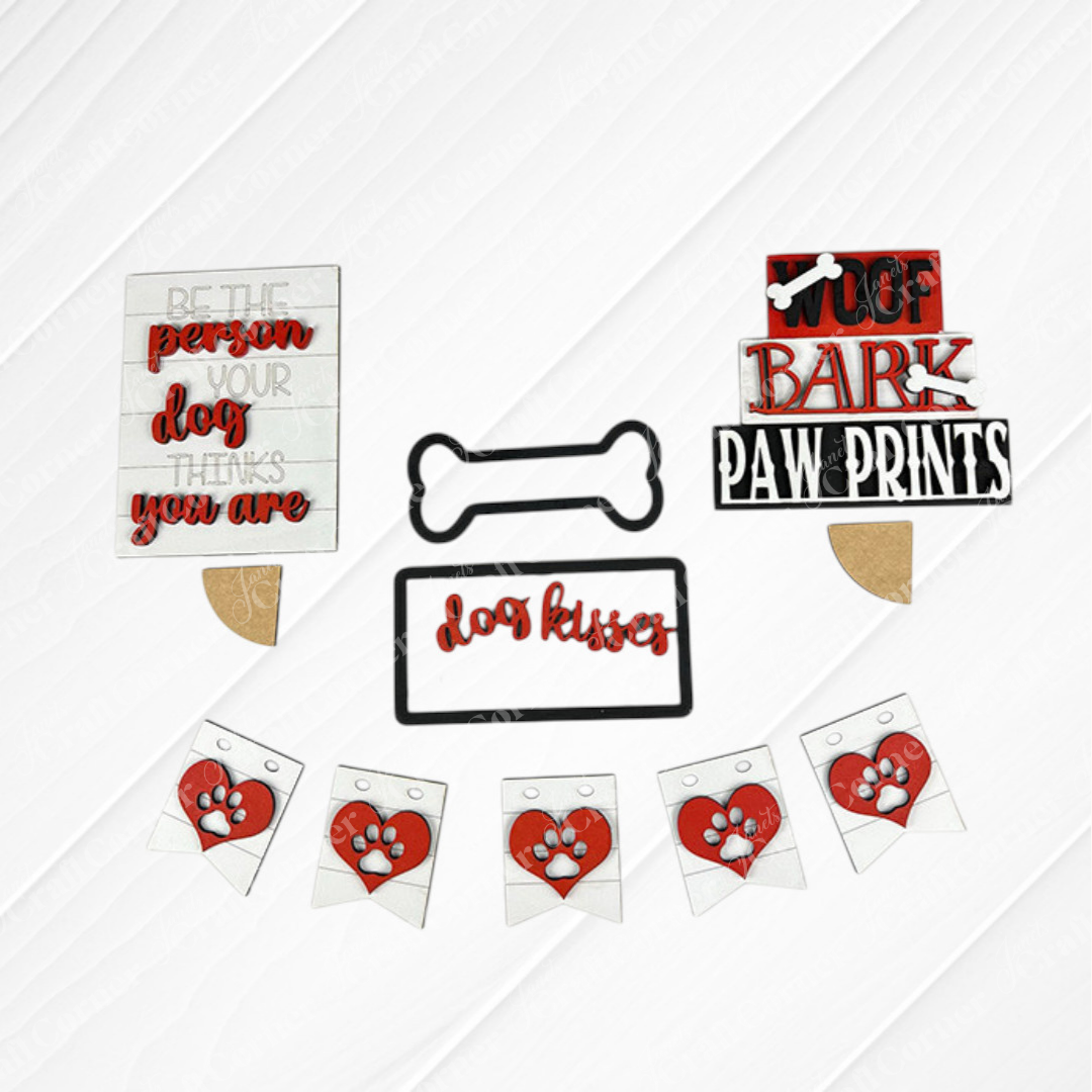 Introducing the Dog Lover Tiered Tray Kit by Janet's Craft Corner, a delightful assortment of decor for dog enthusiasts. This kit includes charming signs and decorations with phrases like "Woof bark paw prints," "Be the person your dog thinks you are," and "Dog kisses fix everything." Adorned with paw print and bone designs, it's the perfect addition to any DIY home decor project.