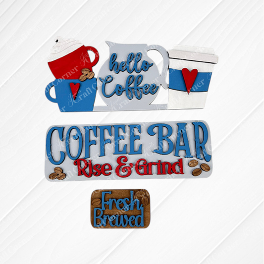 Textured background featuring wooden coffee-themed signs including "Hello Coffee" with blue cups and "Coffee Bar Rise & Grind" in blue and red, offers interchangeable craft inserts for a touch of variety. The "Fresh Brewed" sign is presented on a brown plaque adorned with coffee bean illustrations, resembling a hand-painted DIY craft kit from Janet's Craft Corner's Coffee Bar Interchangeable Insert collection.