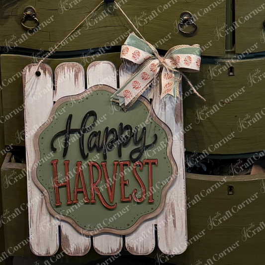 Add a festive touch to your farmhouse fall decor with the Happy Harvest Fence Wall Hanger by Janet’s Craft Corner. This DIY home decor craft kit includes one charming wooden sign, accented with a ribbon and featuring “Happy Harvest” in black and red letters on a green and white background—perfect for displaying in front of olive green drawers or anywhere you’d like to celebrate the season.