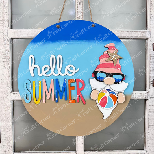 Janet's Craft Corner Hello Summer Gnome Wall Hanger - 10.5" round DIY kit; features a gnome in sunglasses with a pink hat and beach ball plus "hello SUMMER" text. Perfect for summer or beach-themed décor.
