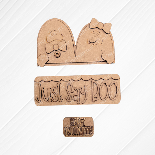 The Just Say Boo Interchangeable Insert by Janet's Craft Corner includes 3 unfinished wood pieces—ghost cutouts with bows, buttons, and Halloween signs—perfect for DIY seasonal home decor.