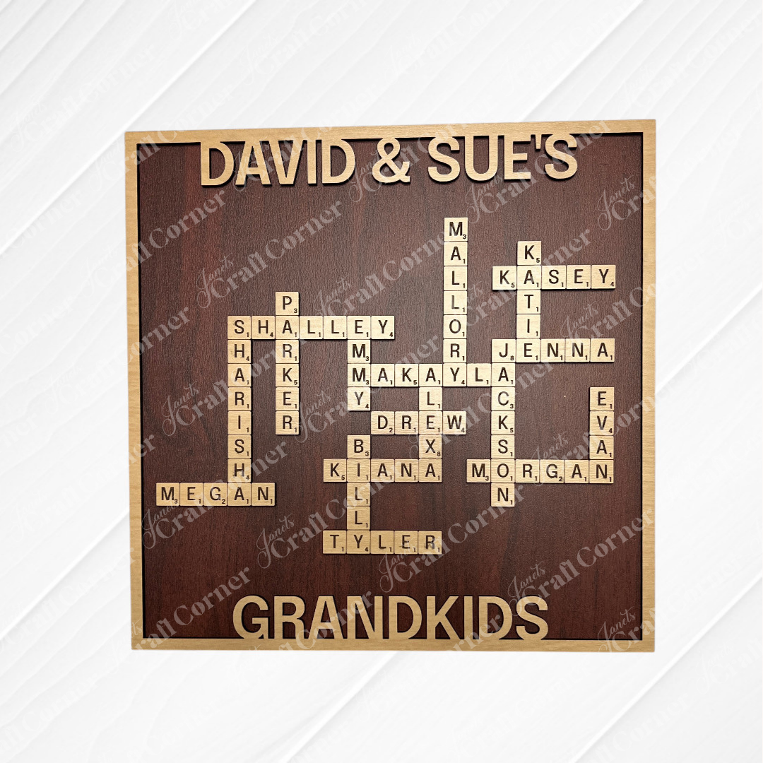 Janet's Craft Corner's Scrabble Board Sign displays "DAVID & SUE'S GRANDKIDS" with grandkids' names arranged in a Scrabble tile crossword—a unique custom gift for teachers or a cherished family keepsake.