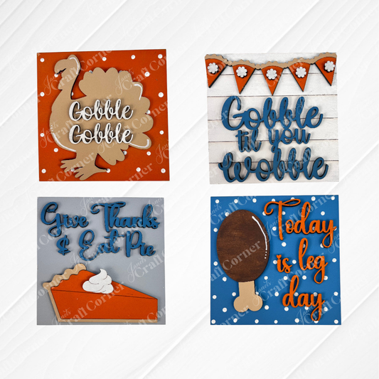 Janet's Craft Corner Thanksgiving Feast Squares feature four wood cut-outs for tiered tray decor: a turkey ("Gobble Gobble"), bunting ("Gobble til you wobble"), pie slice ("Give Thanks & Eat Pie"), and drumstick ("Today is leg day").
