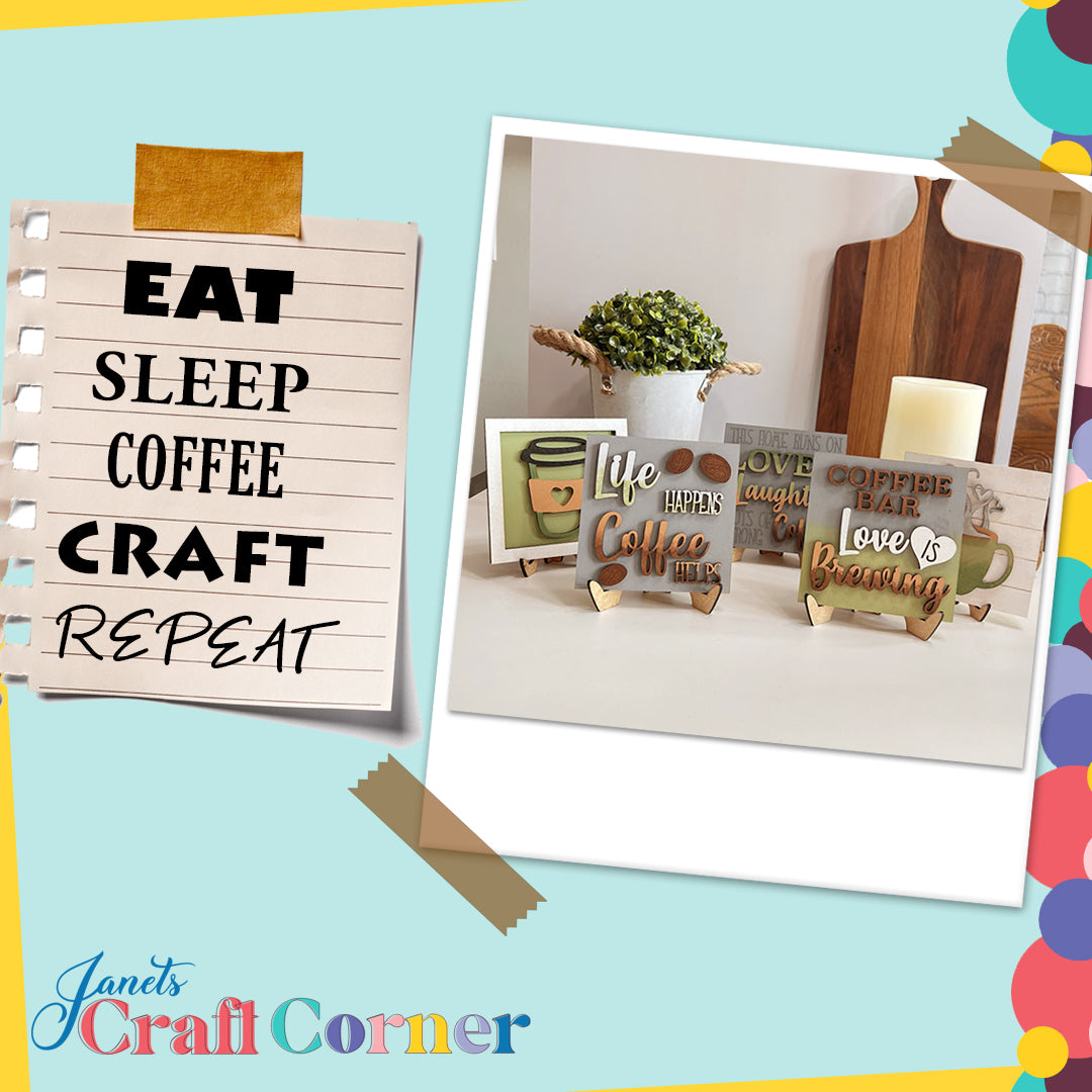 A scrapbook-style graphic features the Coffee Squares by Janet's Craft Corner—a notepad reading "EAT SLEEP COFFEE CRAFT REPEAT" with decorated coffee-themed signs on wood risers, plus plants and a cutting board in the background.