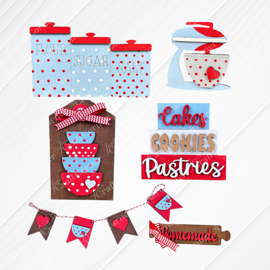 Add a touch of rustic charm to your farmhouse decor with Janet's Craft Corner's Baking - Tiered Tray Kit. This delightful kitchen-themed display features red, blue, and wooden accents, complete with miniature cookware, and canisters labeled "Flour" and "Sugar." It also includes signs for "Cakes," "Cookies," and "Pastries," all finished with charming red polka dot motifs.