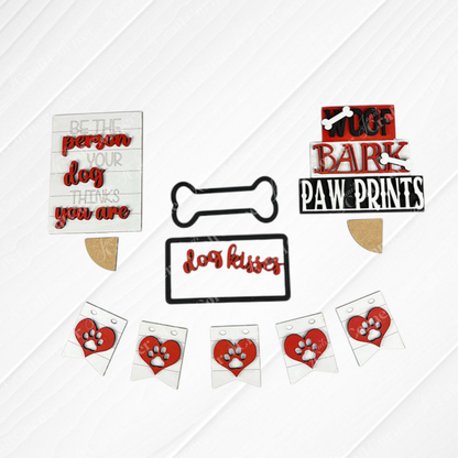 Introducing the Dog Lover Tiered Tray Kit by Janet's Craft Corner, a delightful assortment of decor for dog enthusiasts. This kit includes charming signs and decorations with phrases like "Woof bark paw prints," "Be the person your dog thinks you are," and "Dog kisses fix everything." Adorned with paw print and bone designs, it's the perfect addition to any DIY home decor project.