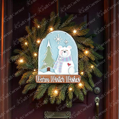The Polar Bear Door/Wall Hanger by Janet's Craft Corner features a bear in a scarf, snowflakes, and "Warm Winter Wishes." With festive lights and a DIY touch, it’s the perfect cozy home decor craft for the season.