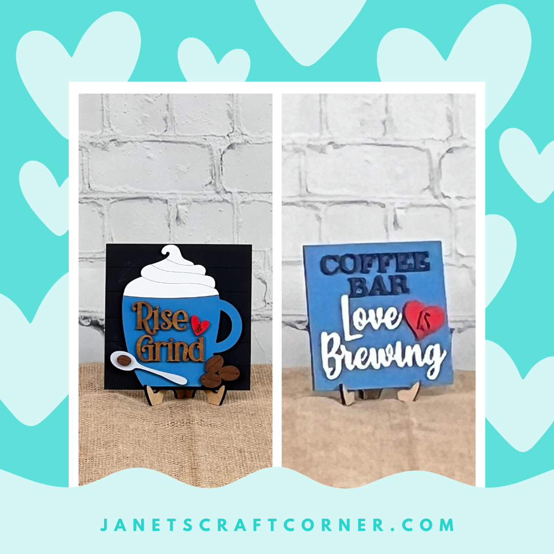 Janet’s Craft Corner Coffee Squares are two blue wood signs with 3D coffee décor. “Rise & Grind” features a cup, and “Coffee Bar, Love is Brewing” adds charm—perfect DIY seasonal accents for small spaces.