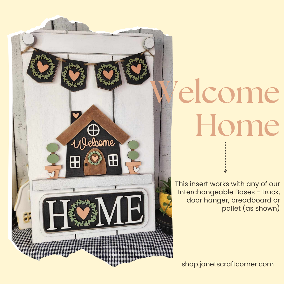 Introducing the "Welcome Home Interchangeable Insert," a charming DIY home decor kit by Janet's Craft Corner. This rustic, hand-painted piece showcases a delightful house design accented with heart garlands and the text "Welcome Home." Perfect for those who love crafting, it is part of our interchangeable collection and can be paired with bases such as a truck, door hanger, or pallet. Visit us at shop.janetscraftcorner.com to explore more!