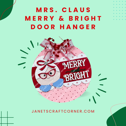 A round, pink "Mrs. Claus Merry & Bright Round Sign" from Janet's Craft Corner features cartoon Mrs. Claus, red and white bows, and "MERRY & BRIGHT." DIY seasonal home decor craft kit; janetscraftcorner.com is noted below.