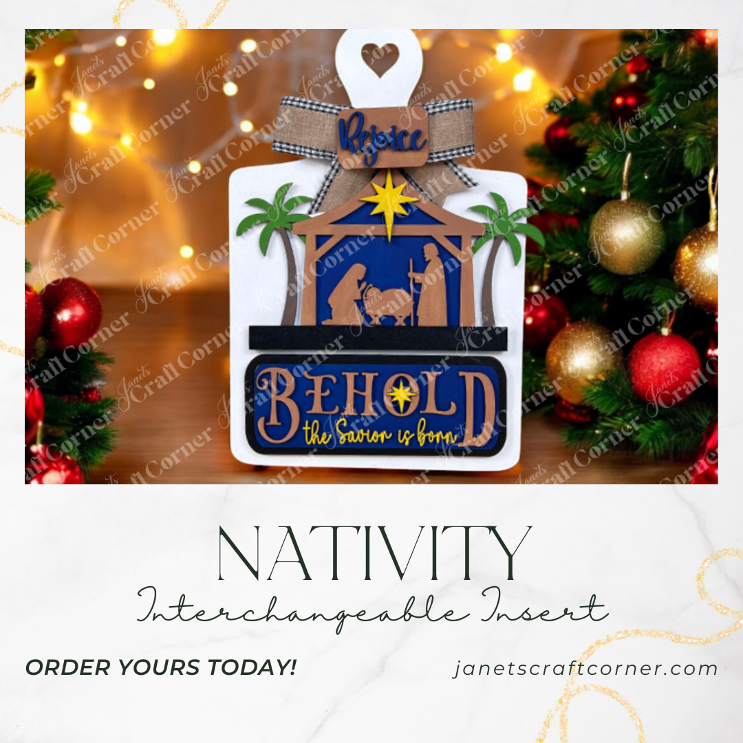A festive ad for Janet's Craft Corner's Nativity Interchangeable Insert features "Behold, the Savior is born" and "Rejoice" and showcases holiday lights and ornaments. Available at janetscraftcorner.com.