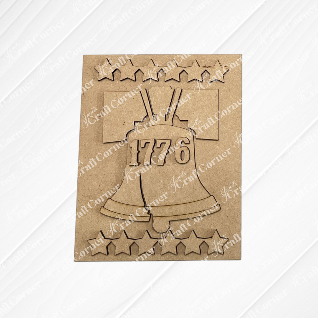 Celebrate American Independence with Janet's Craft Corner Patriotic Farmhouse Signs—a DIY craft kit featuring a laser-cut Liberty Bell with "1776" and stars, perfect tiered tray or farmhouse decor. Set of 1.