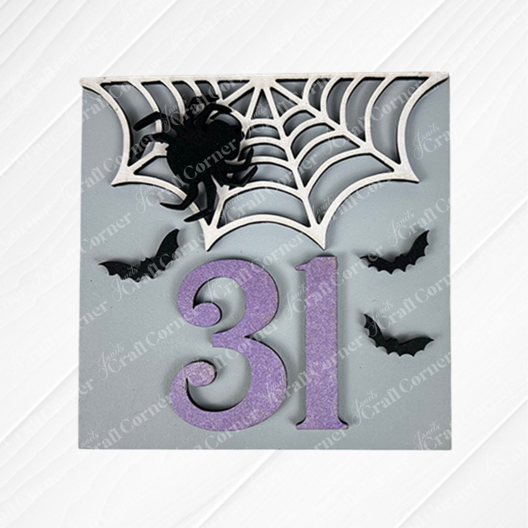 The Oct 31 Squares by Janet's Craft Corner is a decorative sign with a bold purple "31," white spiderweb and black spider, plus three black bats on a light gray background—an ideal accent for your tiered tray decor.