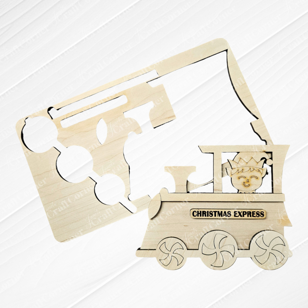 A wooden cutout of a train labeled "Christmas Express," included in Janet's Craft Corner's Elf Train Kids Pop-Out | Early Access set, features a stencil that outlines the parts. This hand-painted craft kit promotes the development of fine motor skills with its cheerful locomotive cabin and detailed wheels against a light wooden background.