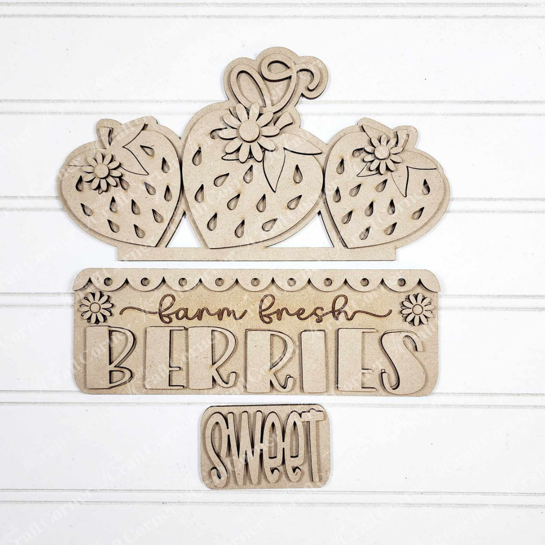 Janet's Craft Corner Fresh Berries Interchangeable Insert DIY kit includes 3 wooden pieces with strawberries, flowers, and engraved "farm fresh BERRIES" and "SWEET" on a white shiplap–style background—ideal for summer home decor.