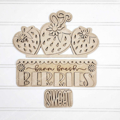 Janet's Craft Corner Fresh Berries Interchangeable Insert DIY kit includes 3 wooden pieces with strawberries, flowers, and engraved "farm fresh BERRIES" and "SWEET" on a white shiplap–style background—ideal for summer home decor.