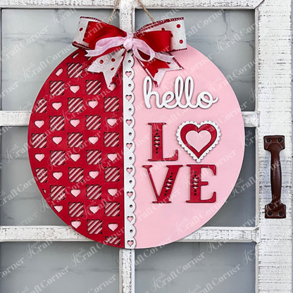 Introducing Janet's Craft Corner's "Hello Love Round Sign" DIY Kit: Delight in creating a beautiful piece of home decor that's perfect for Valentine's Day. This round sign features a sophisticated "hello LOVE" script, with the left half displaying a vibrant red hue adorned with heart patterns and the right half in a soft pink shade. It is elegantly finished with a charming red and white bow.