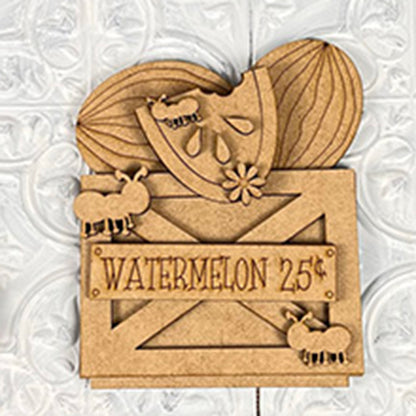 The Watermelon Shelf Sitters by Janet's Craft Corner feature a decorative wood carving of a watermelon slice and whole watermelon accompanied by three ants. A rustic sign beneath reads "WATERMELON 25¢," making it perfect for farmhouse décor. This charming piece has a DIY Kit style and is set against a textured white background.