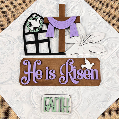 This Easter-themed decoration, from Janet's Craft Corner, showcases a cross adorned with a purple cloth, a dove, and lilies. It features "He is Risen" in purple and "FAITH" in green on a wooden backdrop. Ideal for home decor, the He is Risen Interchangeable Insert - Painted offers versatile seasonal updates with its interchangeable inserts.
