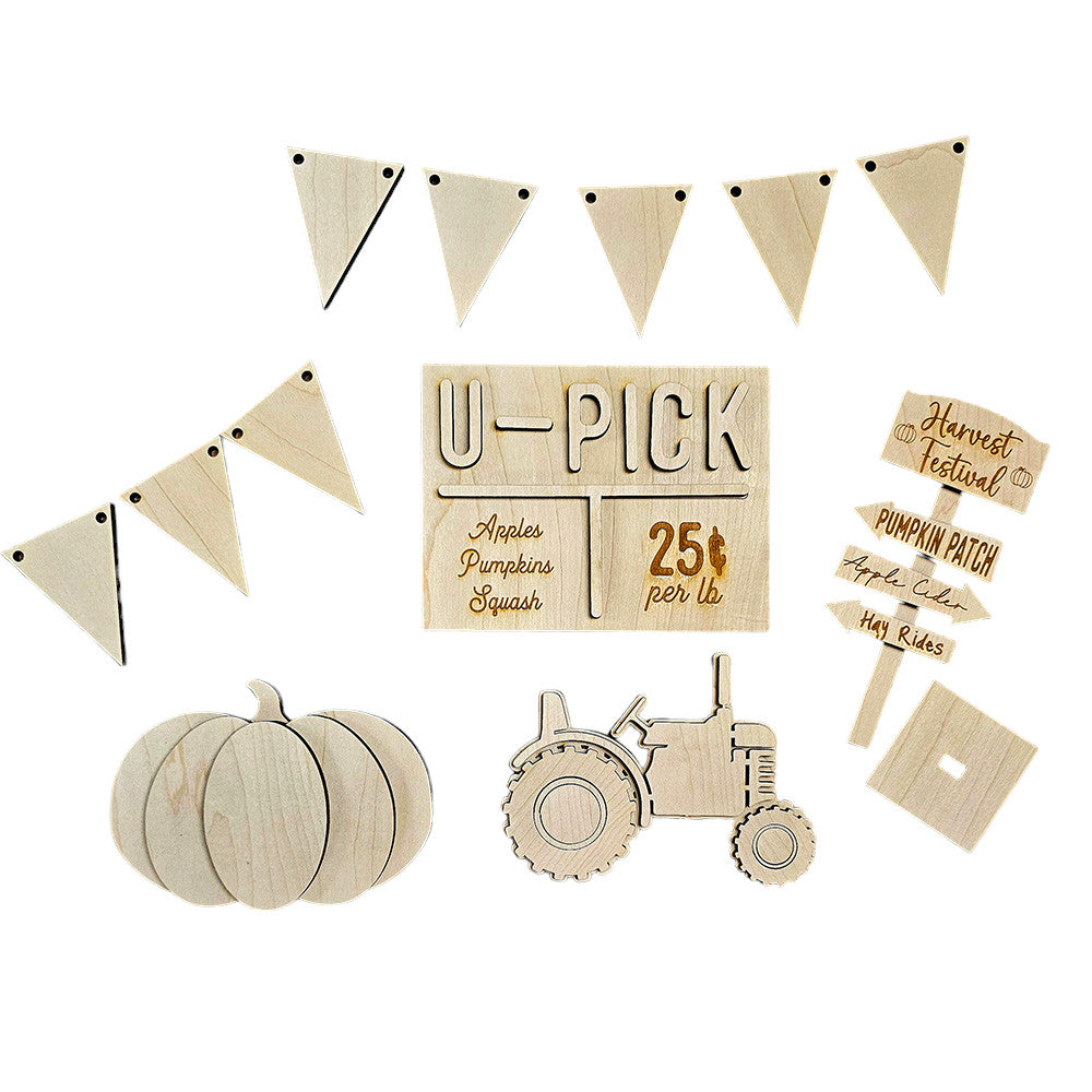 Experience the charm of fall with Janet's Craft Corner's Harvest Festival Decor Set, a 5-piece DIY home decor kit. This beautifully crafted set features a hand-painted "U-Pick" sign adorned with apples, pumpkins, and squash, complemented by a triangular banner, tractor, pumpkin shapes, and directional signs designed for your harvest festival. Perfect for adding a personalized touch to your home décor or enhancing your Harvest Festival decorations.