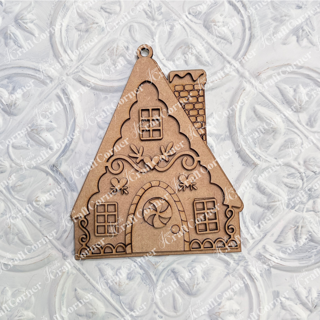 Janet's Craft Corner Gingerbread Ornaments – DIY holiday craft kit – Set of 8, shaped like gingerbread houses with engraved windows, doors, and patterns, ideal for crafting and displayed on a textured white surface.