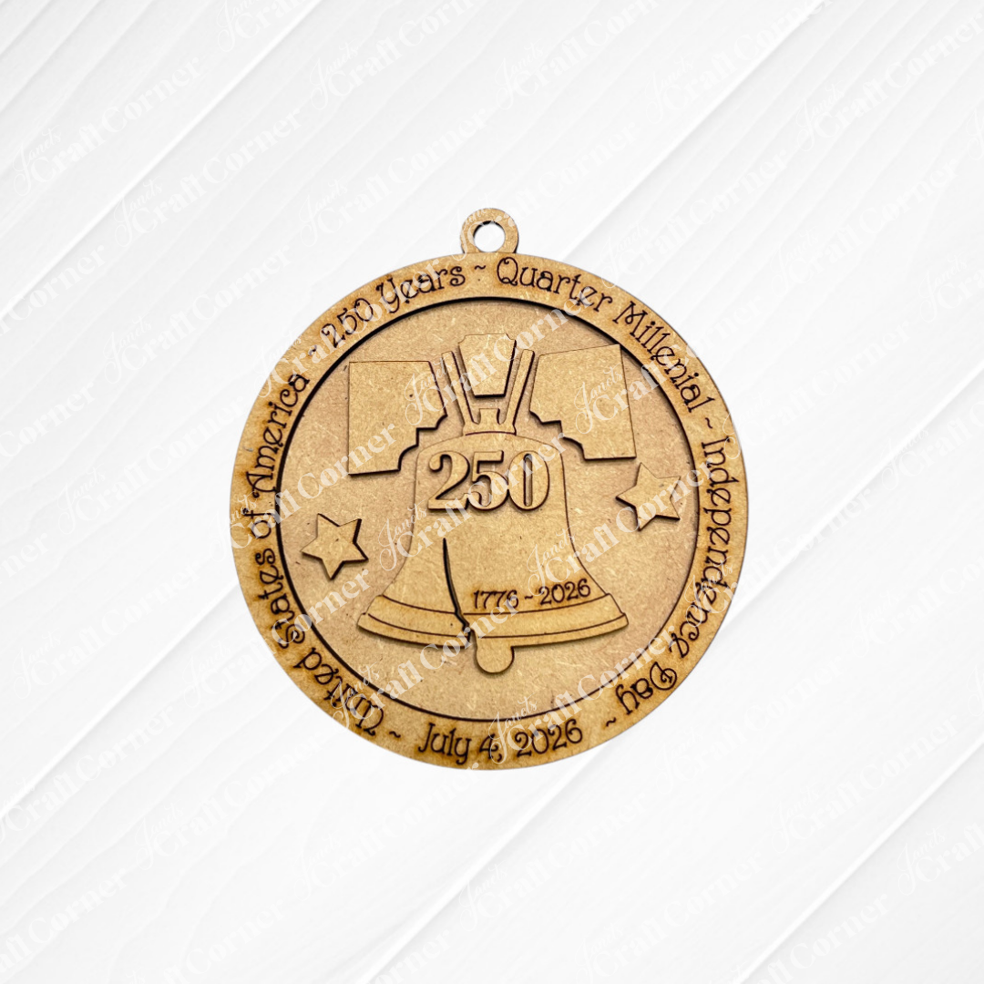 The America 250 Ornament - DIY Craft Kit by Janet's Craft Corner features a gold medal with the Liberty Bell, "250," and "1776-2026" inscribed, ideal for a custom ornament or use with a wood ornament kit.
