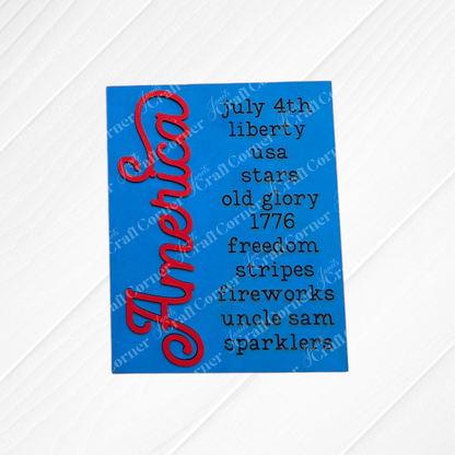 Janet's Craft Corner Patriotic Farmhouse Signs DIY kit features a blue card with "America" in red script and festive 4th of July motifs—perfect for adding a cheerful, patriotic touch to your tiered tray or farmhouse decor. Set of 1.
