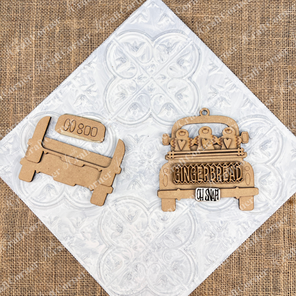 A wooden cutout depicting a vintage truck set against a white textured backdrop. An Antique Truck Ornament from Janet's Craft Corner's DIY Decoration Kits, showcases "Gingerbread Oh Snap" along with gingerbread figures and heart details on its bed. The scene rests atop patterned white tiles over burlap, making it ideal for Christmas décor.