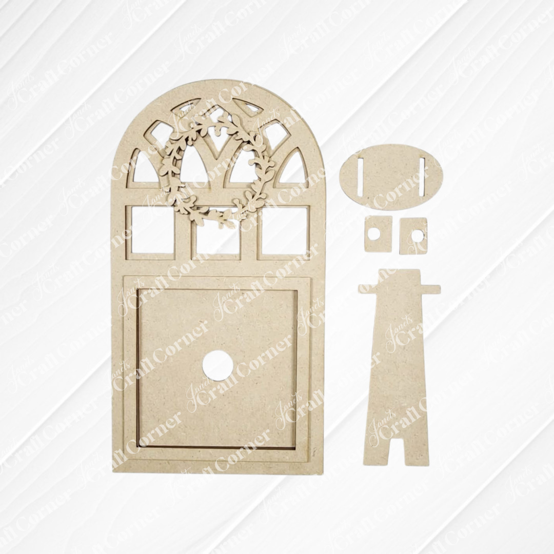 Janet's Craft Corner Arch Window Interchangeable Frame for Squares DIY Farmhouse Decor Kit includes laser-cut MDF pieces to create a miniature fairy door, arch window frame, small wreath, and extra parts—ideal for farmhouse home décor. Displayed on a white background.