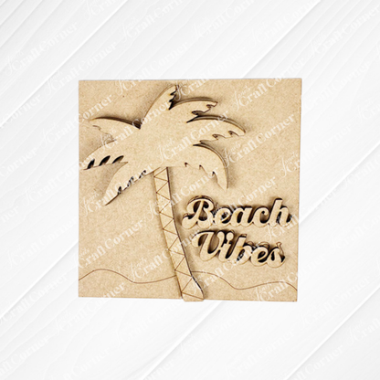 Janet's Craft Corner’s Summer Beach Squares DIY kit includes a laser-cut wooden sign with a palm tree and "Beach Vibes" in cursive, perfect for tiered tray or coffee bar decor on a light, textured background.
