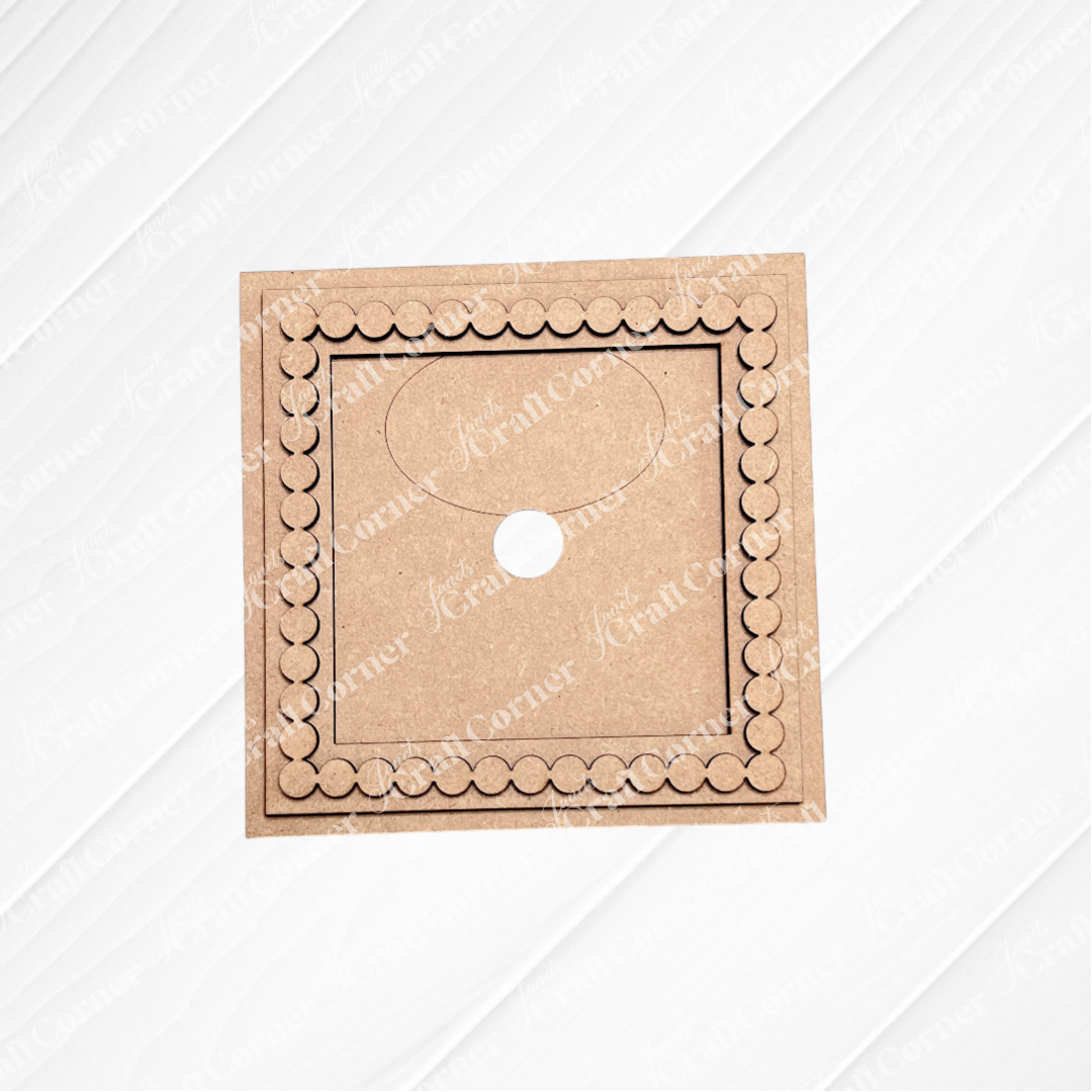 The Heartland Bead Trim Swappable Squares Frame is a square brown cardboard piece with a scalloped border, semicircular tab, and central hole—perfect for DIY craft kits or interchangeable signs—shown on a white textured background.