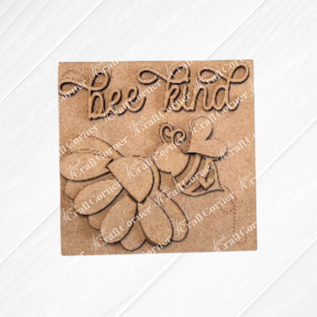 Janet’s Craft Corner’s Bee Swappable Squares is a DIY wooden kit with a bee, heart wings, and "bee kind" in cursive on an embossed white background—perfect for creative crafting enthusiasts.