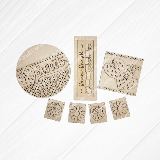 The Berry Sweet Decor Set - Summer DIY Craft Kit from Janet's Craft Corner includes four laser-cut, unfinished wood pieces: a "Sweet" round sign, "Farm fresh BERRIES" panel, strawberry square, and four floral tags for charming berry-themed decor.