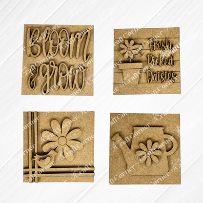 Janet's Craft Corner "Bloom & Grow Squares" includes four wooden plaques: "Bloom & Grow" text, "Fresh Picked Daisies," a daisy with bird, and a watering can—ideal spring Swappable Squares for small space decor.
