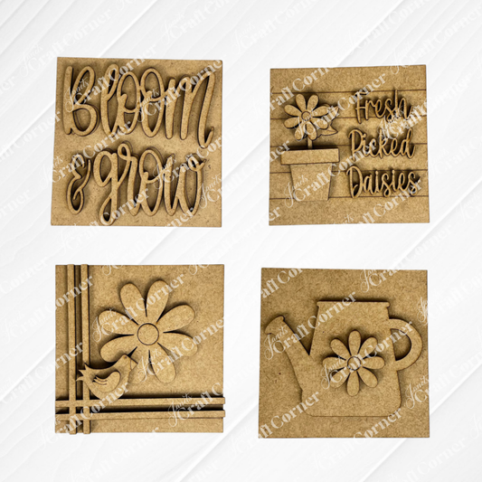 Janet's Craft Corner "Bloom & Grow Squares" includes four wooden plaques: "Bloom & Grow" text, "Fresh Picked Daisies," a daisy with bird, and a watering can—ideal spring Swappable Squares for small space decor.