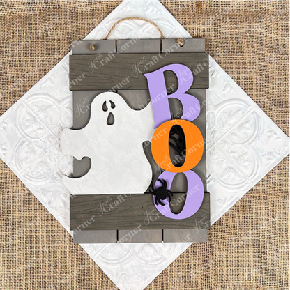 The Boo Fence Door Hanger from Janet's Craft Corner is a versatile DIY kit. It showcases a wooden white ghost silhouette next to vibrant "B," "O," and "O" letters in purple and orange. Ideal for your door, it enhances your home décor with its festive touch and burlap-textured background.