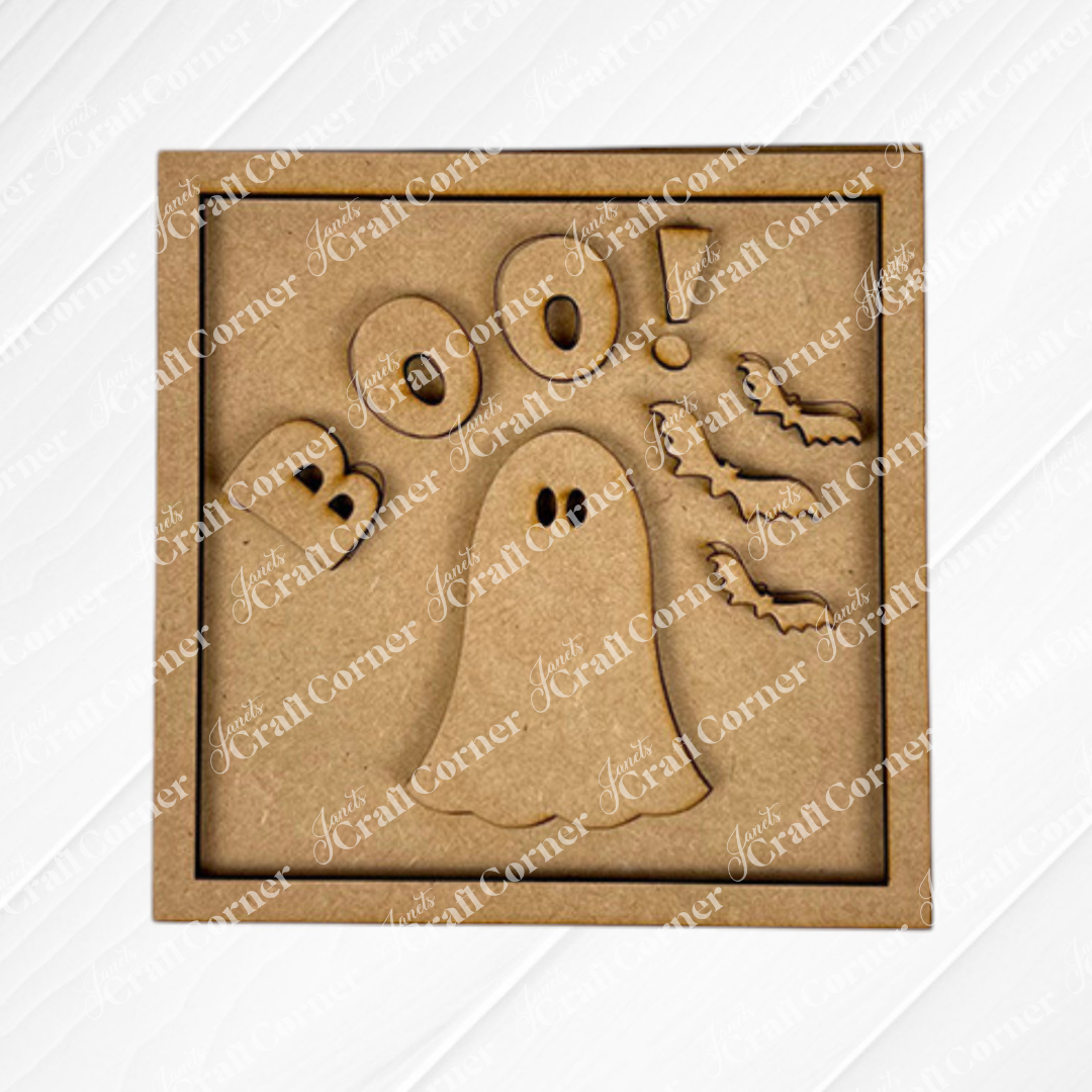 Janet's Craft Corner's Oct 31 Squares is a square wooden Halloween decor piece featuring "BOO!", a ghost, and bats on a light diagonal-patterned background—perfect for your tiered tray setup.