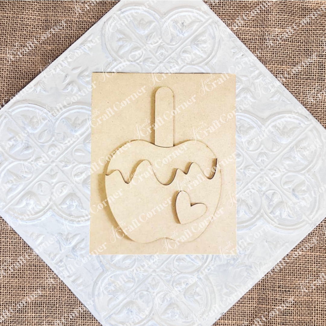 Janet's Craft Corner – Sample painted set of Apple Cider Switchable Farmhouse Signs are DIY seasonal home decor kits with a fall apple theme. One features the wood cut-out word “Cider Season” with words that evoke the scent of apples in the air, another features a caramel apple complete with heart and the last features an antique truck with a load of apples.