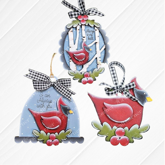 Create heartfelt keepsakes with Janet’s Craft Corner’s Cardinal Ornaments DIY holiday craft kit, which includes your choice of three memorial designs. Each ornament features a red cardinal, holly accents, and black-and-white plaid bows. Sentiments like “Always on my heart” and “I am always with you” appear against backgrounds of snowy birch trees—perfect for crafting meaningful ornaments in memory of loved ones.