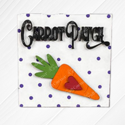 A white napkin from Janet's Craft Corner’s "Easter Bunny Squares" features purple polka dots, a cutout orange carrot with green leaves, a small red heart, and "Carrot Patch" in black script—perfect for tray decor or wood cut-outs.