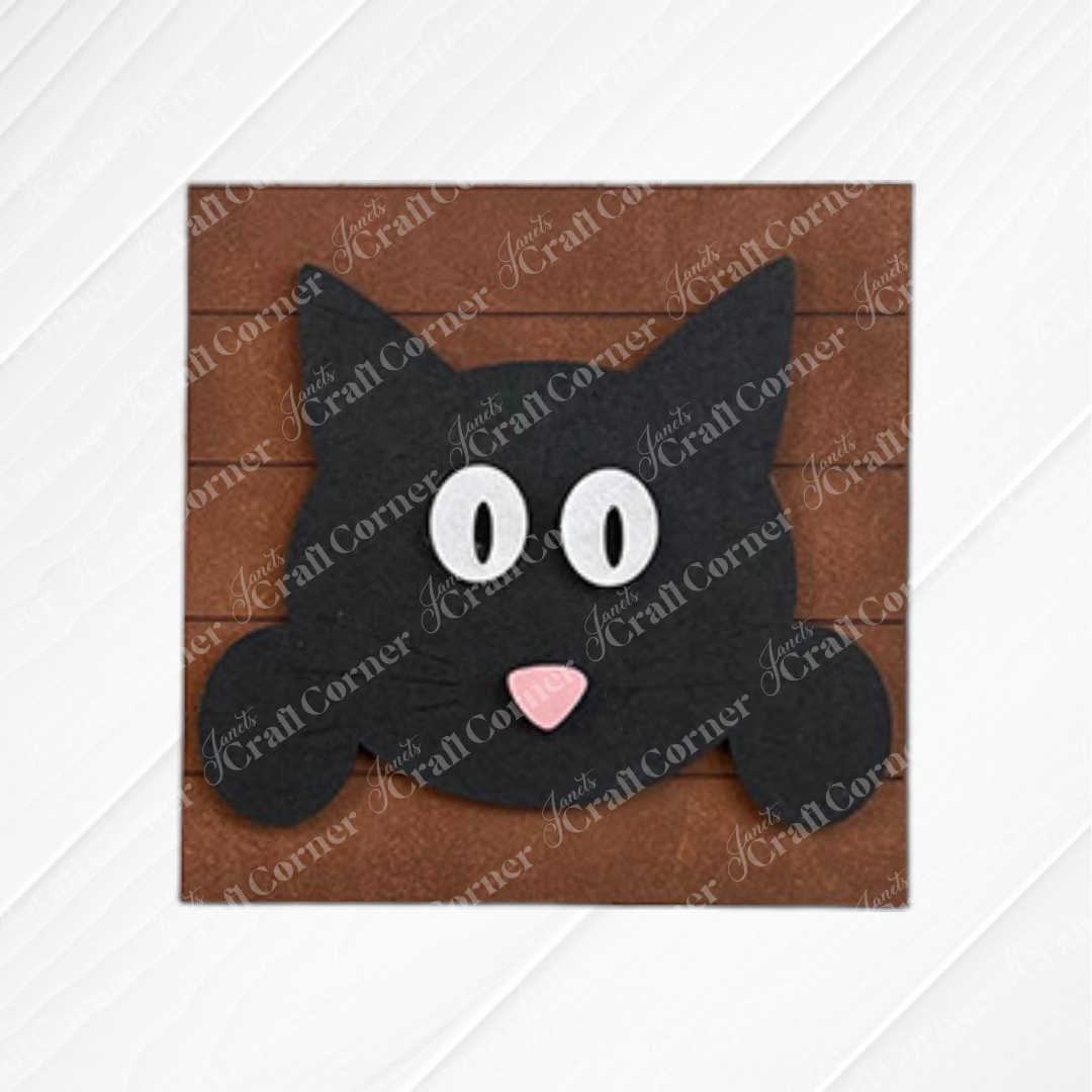 Janet's Craft Corner Cat Swappable Squares feature a black cat wood cut-out with a pink nose, set on a brown square—ideal DIY home decor for any season against white wood.