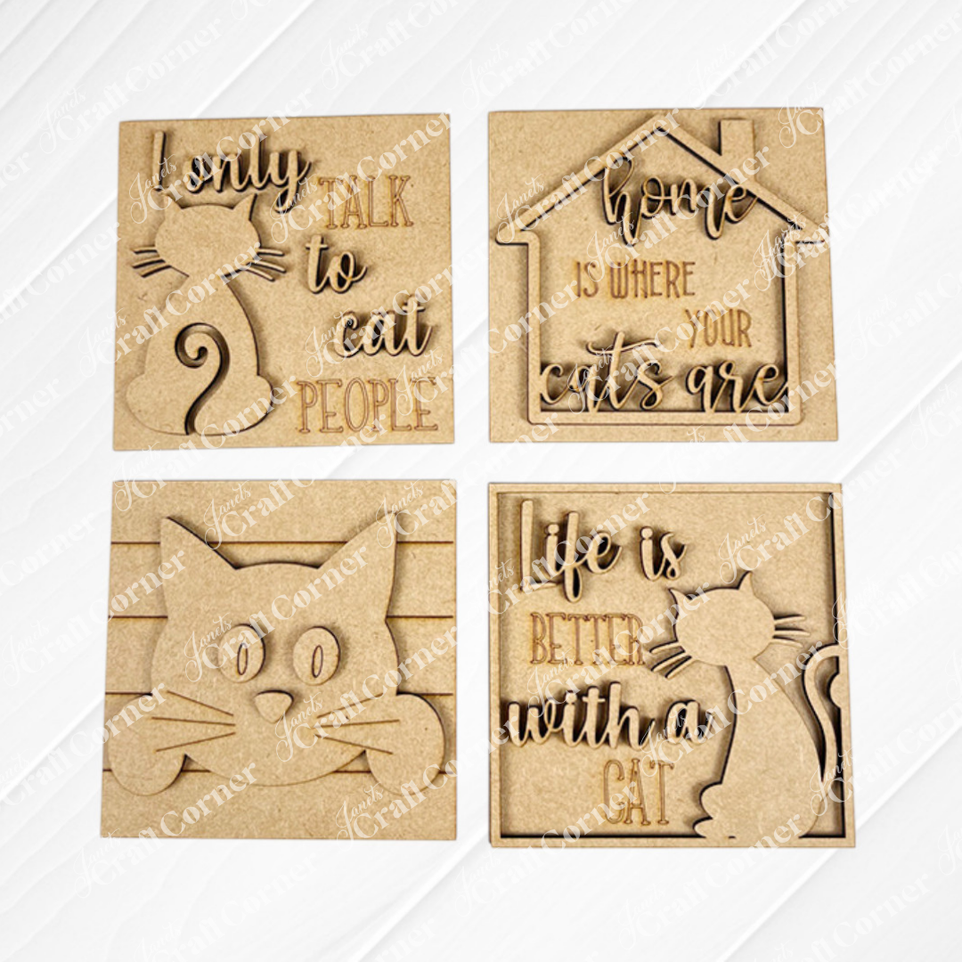 Janet's Craft Corner Cat Swappable Squares are four wooden plaques with cat-themed cut-out designs and engraved cat lover quotes, perfect for DIY seasonal home decor. Includes cat silhouettes, a house outline, and a cat face.
