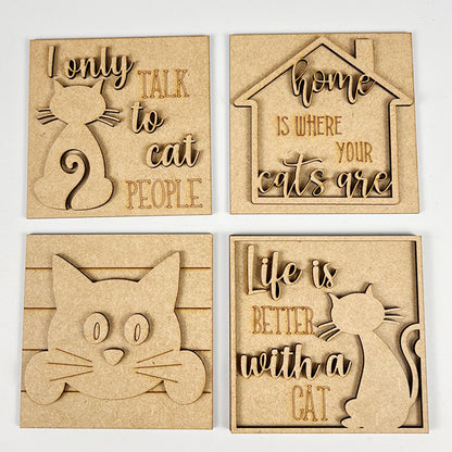 Janet's Craft Corner Cat Swappable Squares are four wooden plaques with cat-themed cut-out designs and engraved cat lover quotes, perfect for DIY seasonal home decor. Includes cat silhouettes, a house outline, and a cat face.