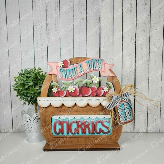Janet's Craft Corner wooden basket base with cherry-themed interchangeable inserts for seasonal farmhouse decor.