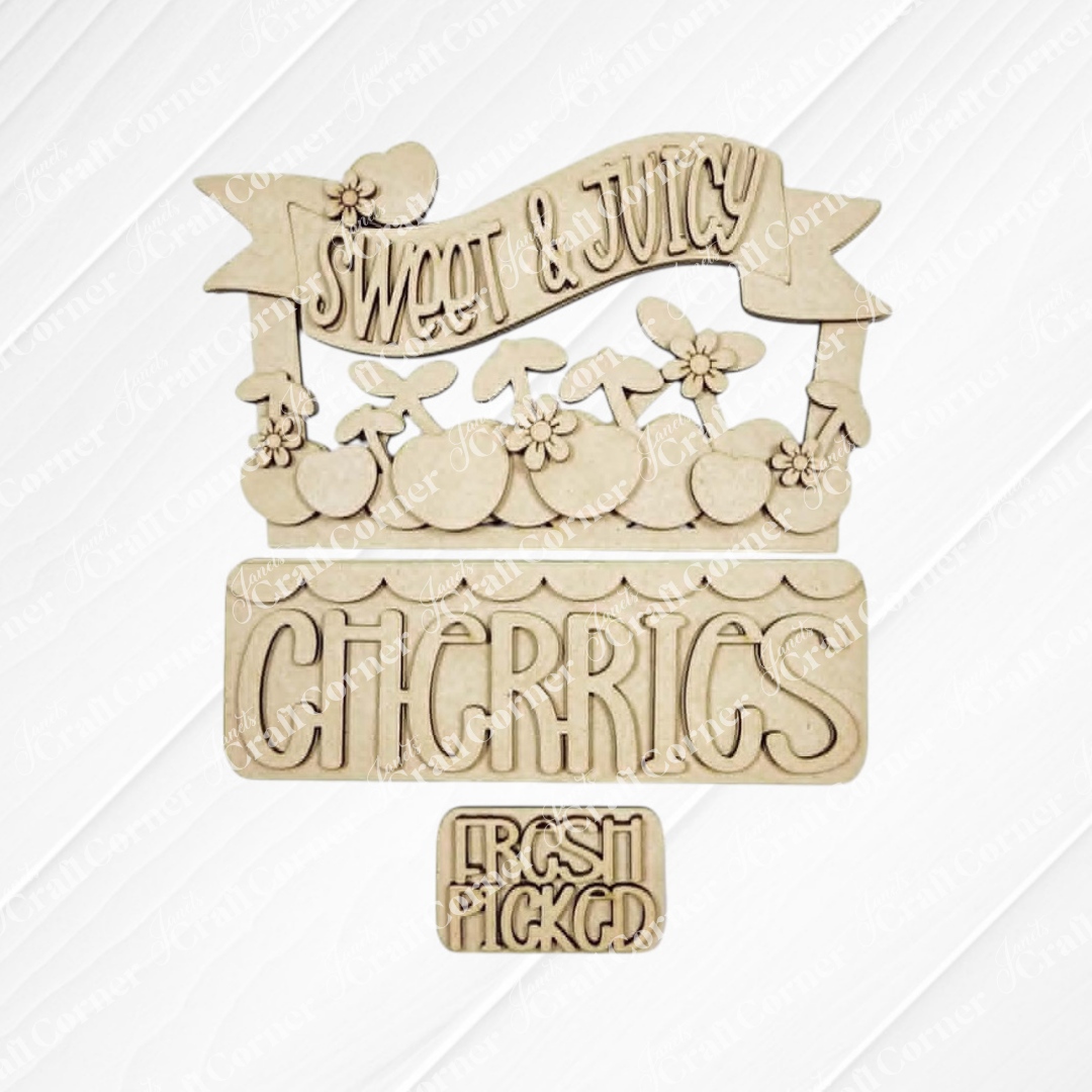 The Cherries Insert from Janet's Craft Corner features "Sweet & Juicy," "Cherries" with cherry art, and "Fresh Picked" on wood cutouts, perfect for DIY seasonal decor or as an unfinished craft kit.
