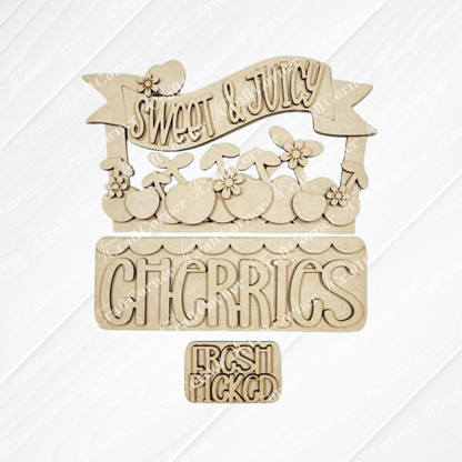 The Cherries Insert from Janet's Craft Corner features "Sweet & Juicy," "Cherries" with cherry art, and "Fresh Picked" on wood cutouts, perfect for DIY seasonal decor or as an unfinished craft kit.