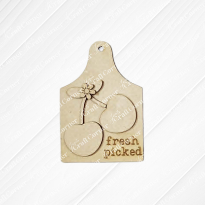 The Cherry Decor Set by Janet's Craft Corner includes a wooden cutting board tag engraved with two cherries, leaves, and “fresh picked”—an ideal unfinished wood craft for farmhouse-inspired DIY home decor accents.
