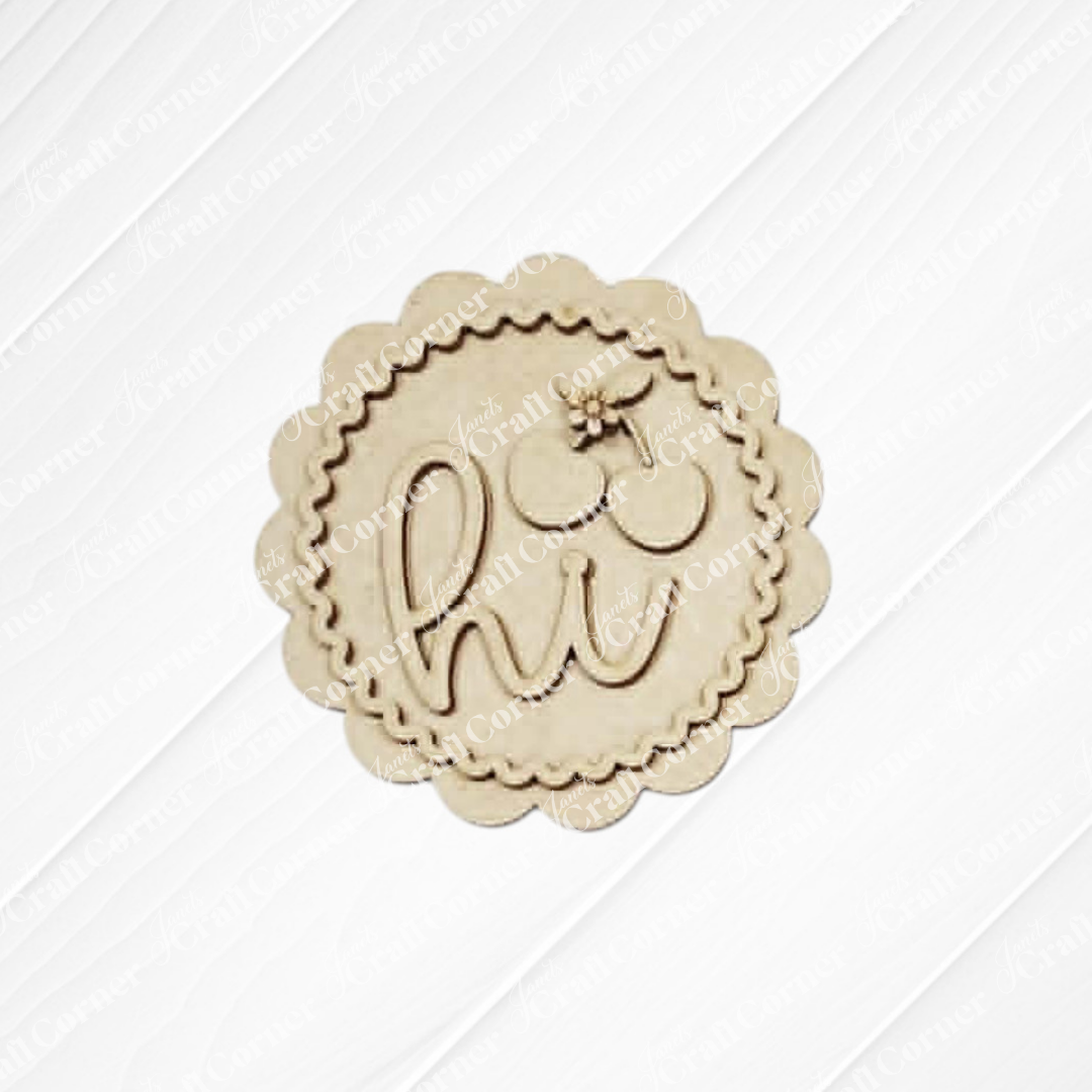 The Cherry Decor Set by Janet's Craft Corner features a round, scalloped unfinished wood cutout engraved with "hi" and a flower above the “i”—ideal for DIY home decor kits or farmhouse accents.