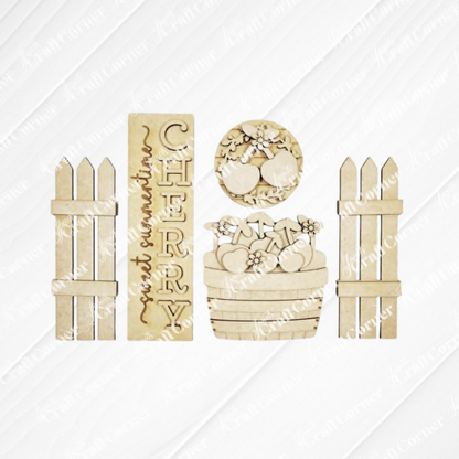 The Cherry Interchangeable Porch Set by Janet's Craft Corner features farmhouse-style wooden cutouts: a "CHERRY" sign, round cherry piece, cherry basket with flowers, and two picket fences—ideal for DIY seasonal home decor inserts.