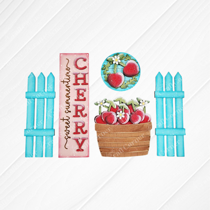 The Cherry Interchangeable Porch Set by Janet's Craft Corner features blue fence posts, a pink "sweet summertime CHERRY" sign, a cherry-and-flower plate, and a wooden cherry basket—ideal DIY farmhouse-style seasonal home decor.